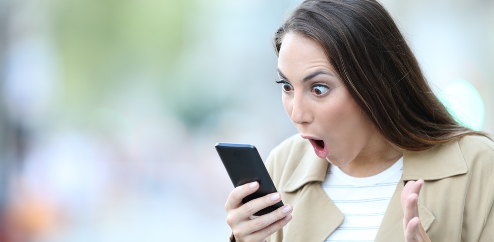 A Sad Shocked woman speaking with the Phone in the Street in Paris.